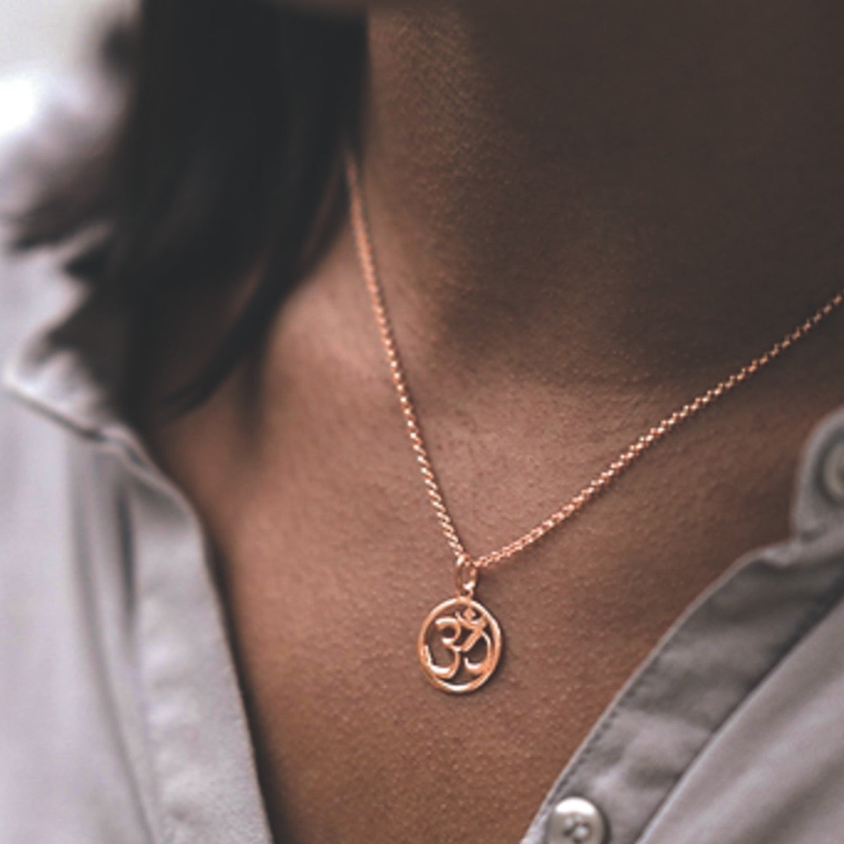 Om symbol deals gold pendant